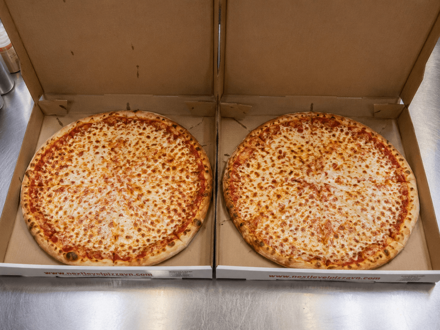 2 Medium Cheese Pizzas